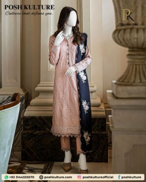 Full-length image of a model wearing a light pink Dhanak suit with embroidery on the shirt, paired with a black Dhanak shawl featuring heavy floral embroidery.